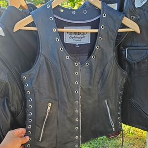 Unik nwt leather motorcycle vest. Women's xs